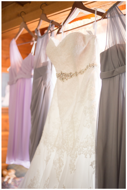 purple and grey bridesmaid dresses, wedding dress hanging up, getting ready wedding pictures, wooden wedding dress hanger