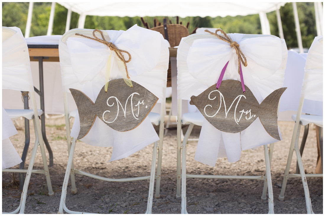 fish themed wedding ideas, back of chair wedding ideas, fish shaped mr and mrs signs, two less fish in the sea wedding